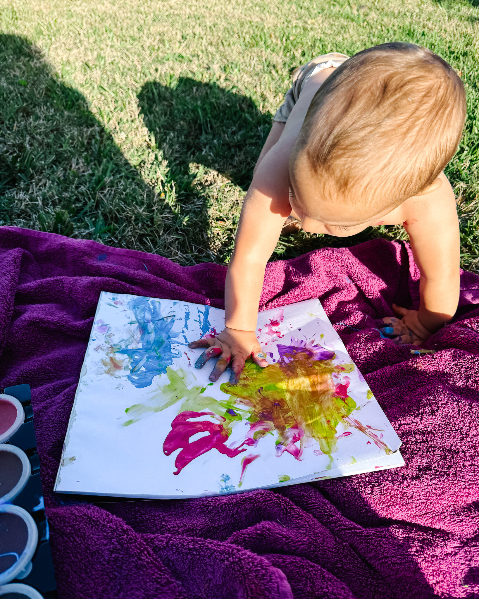 Zion Dunn creating his first painting at one year old