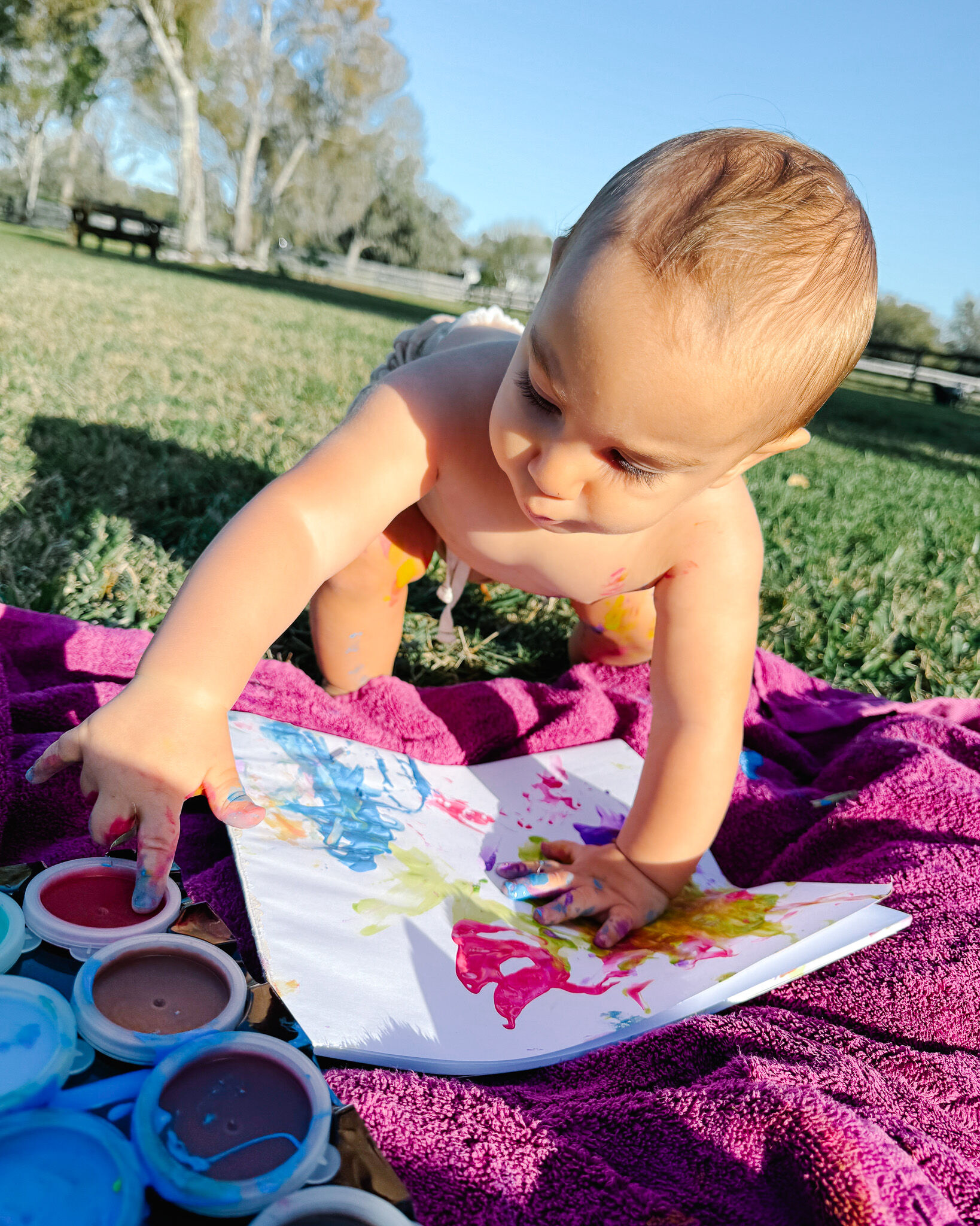 Zion Dunn creating his first painting at one year old