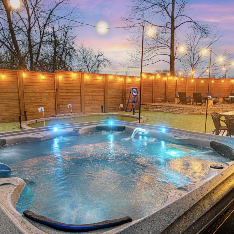Hot tub at dusk - Fall Send Asheville house