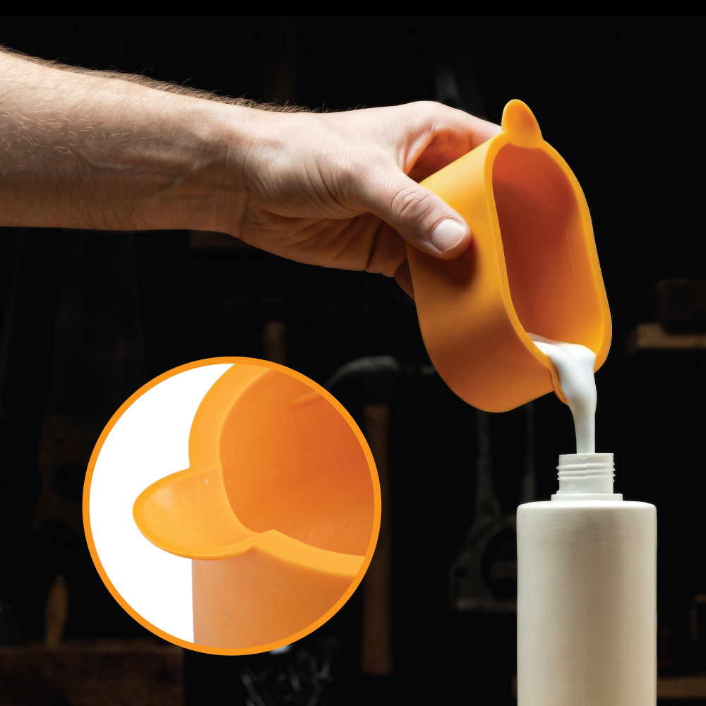Pouring unused wood glue from the keeper back into the bottle to reduce waste