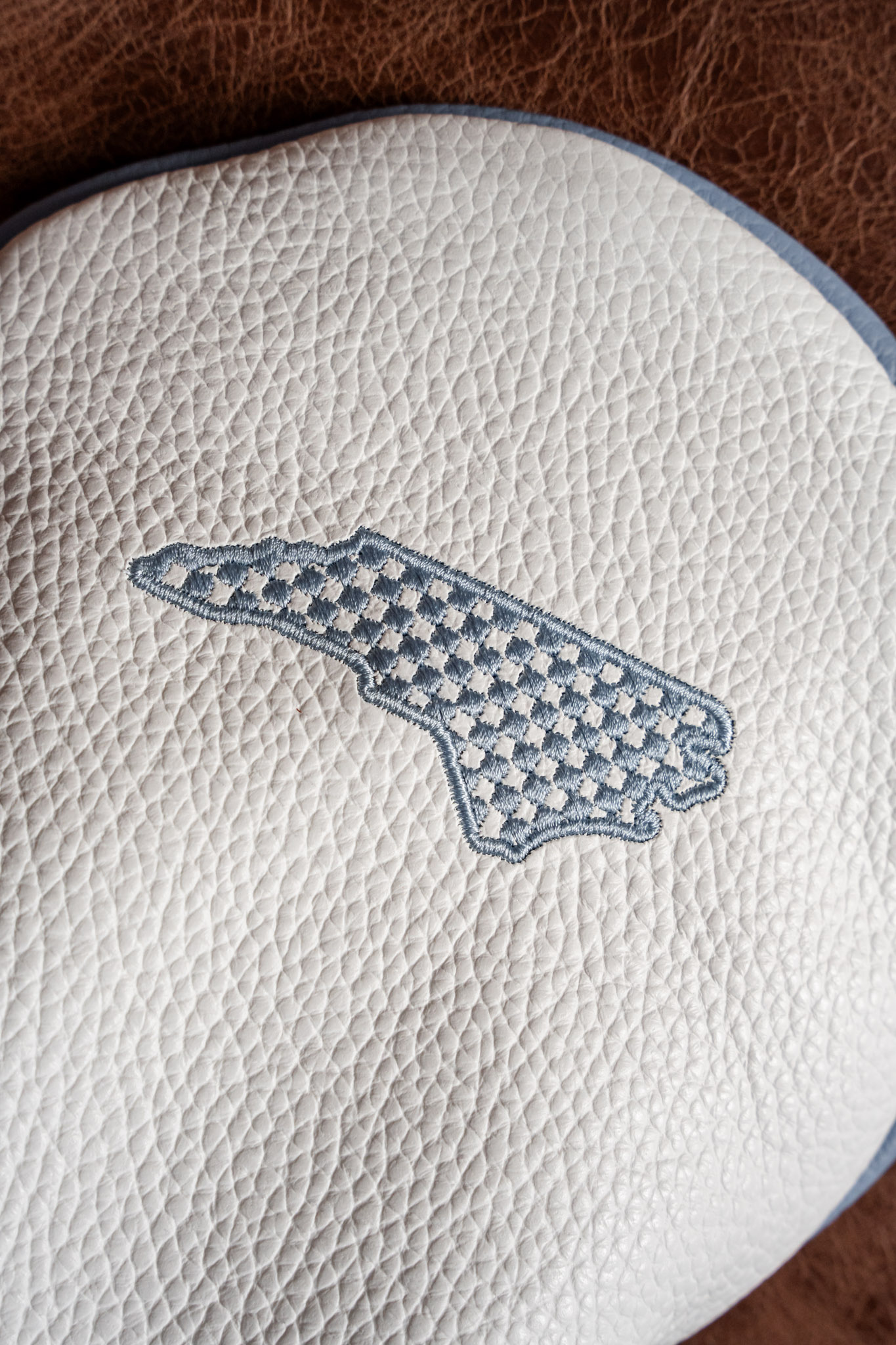 Close-up detail of an iliac leather headcover