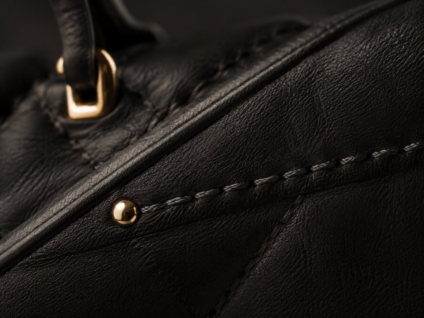 The Story Behind The Bag gold hardware detail