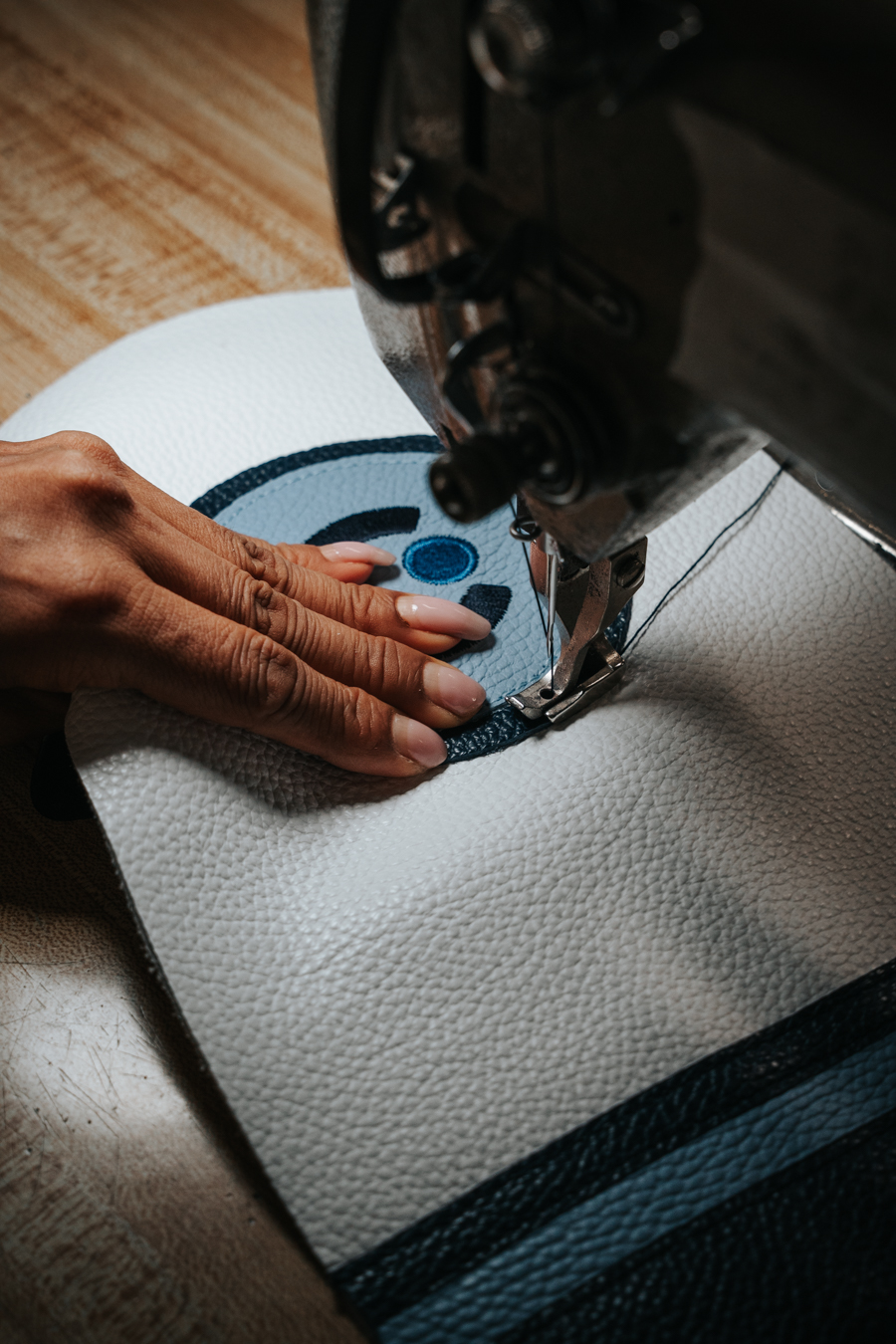 An iliac piece being sewn by hand in the workshop