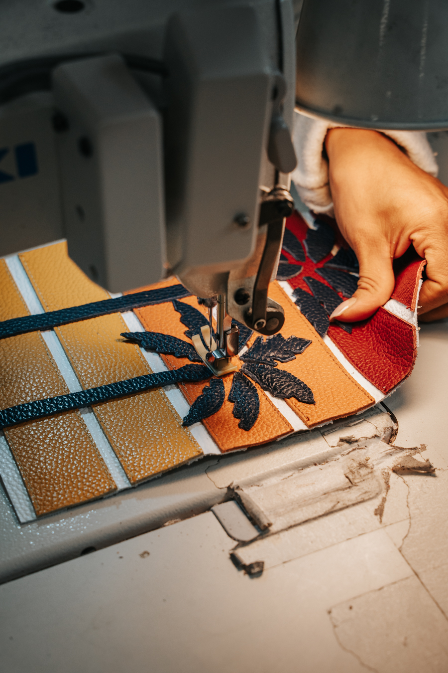 Stitching an iliac leather piece by hand