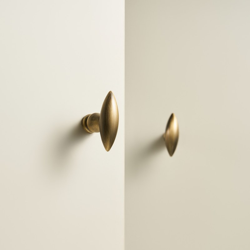 OLIVA Solid Brass Knob in antique brass fitted to cabinet doors
